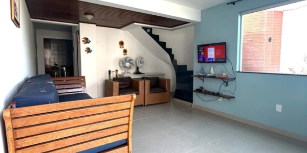 Sala de estar integrada em casa de temporada no Atalaia Salinas Pará.